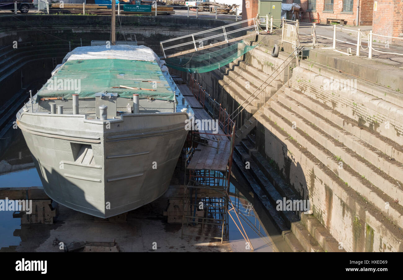 Unpowered barge Sabrina 5 being repaired and restored in Gloucester