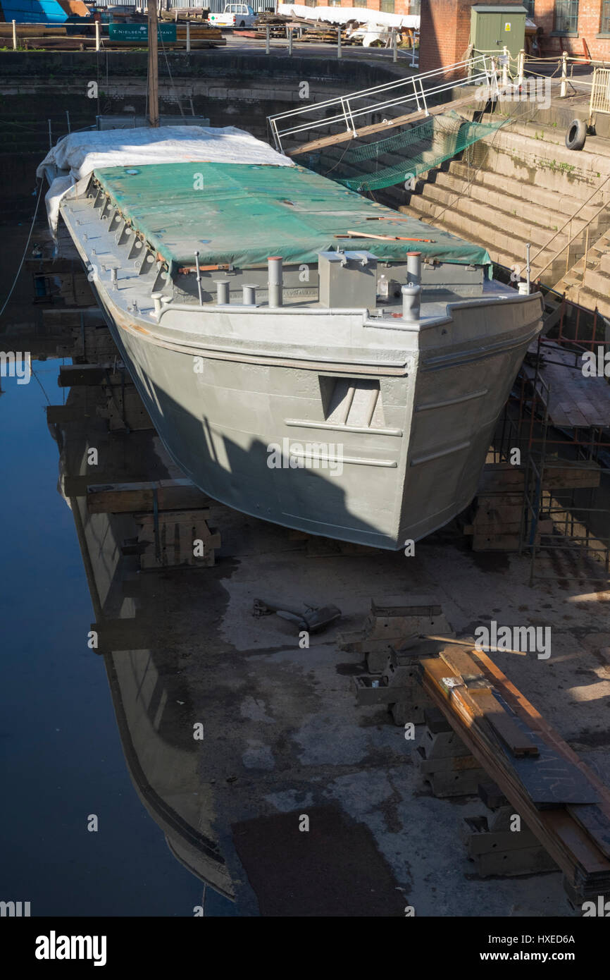 Unpowered barge Sabrina 5 being repaired and restored in Gloucester
