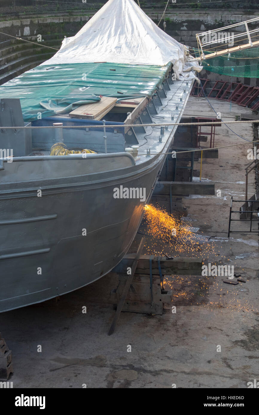 Unpowered barge Sabrina 5 being repaired and restored in Gloucester