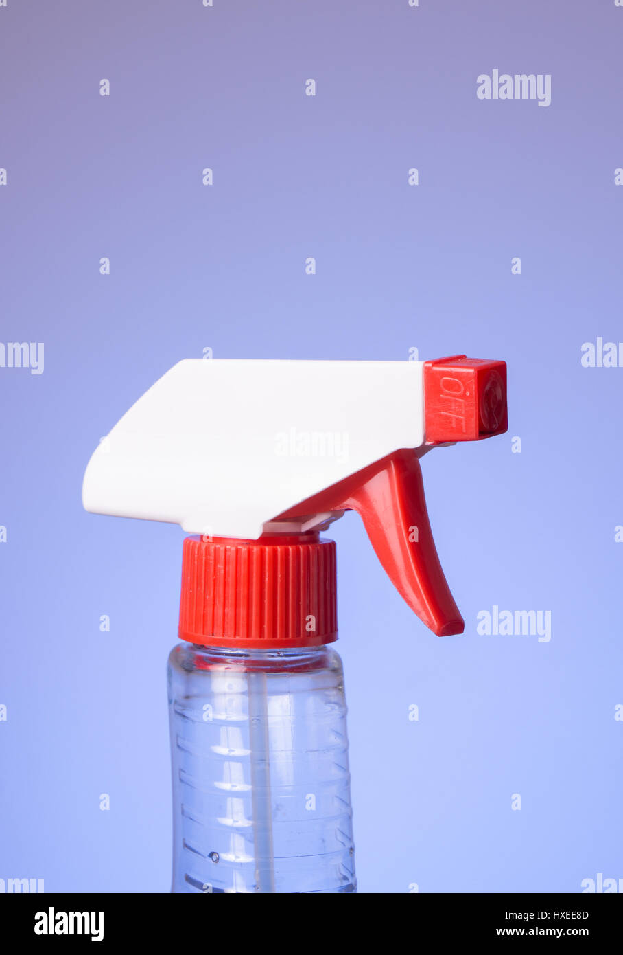 Top of squeeze spray bottle isolated on bluish background Stock Photo