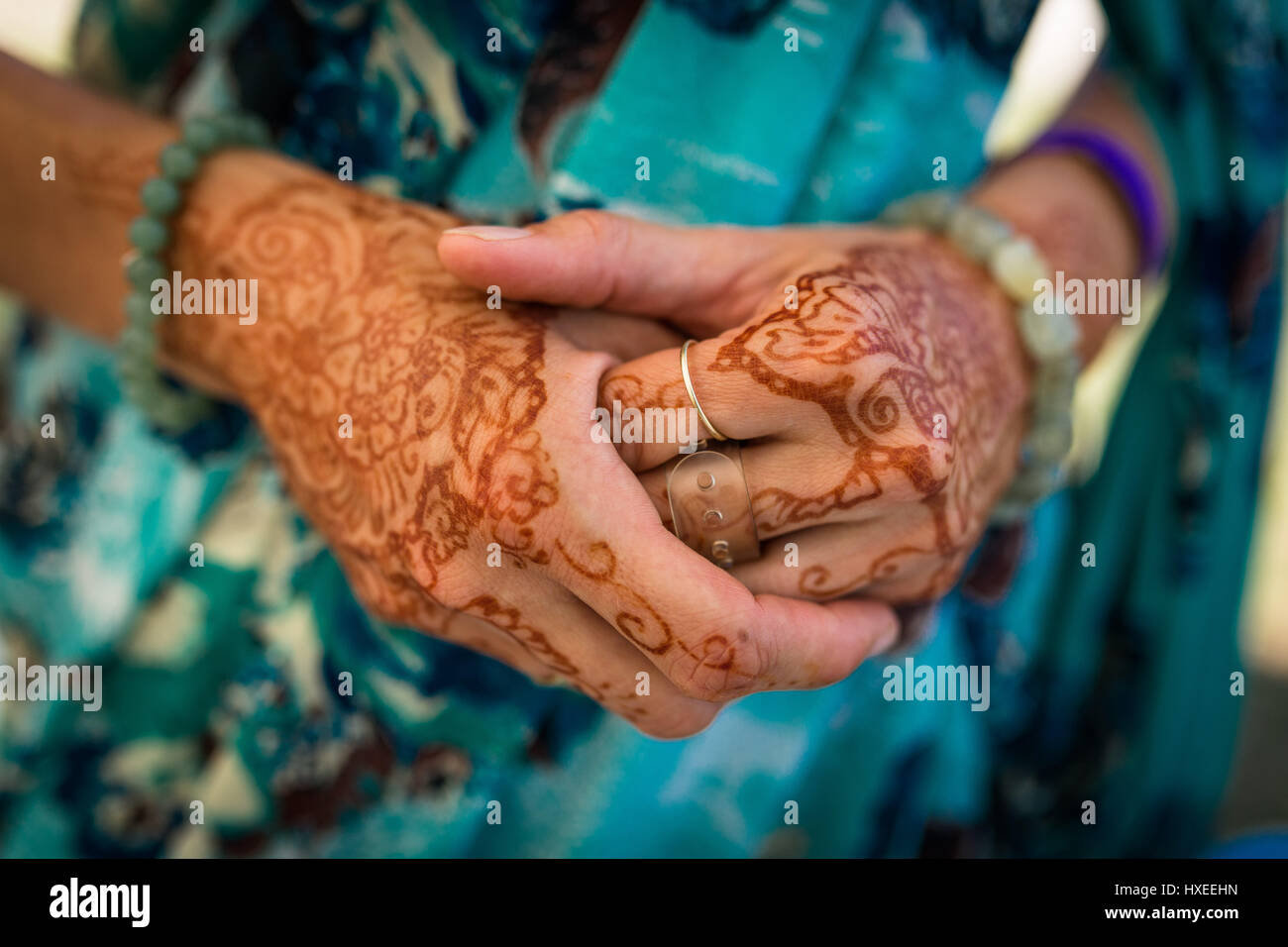 Henna hands of a female devotee Stock Photo