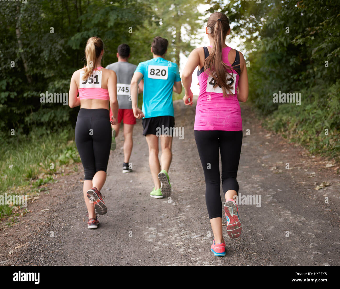 Rear view on the running people Stock Photo - Alamy