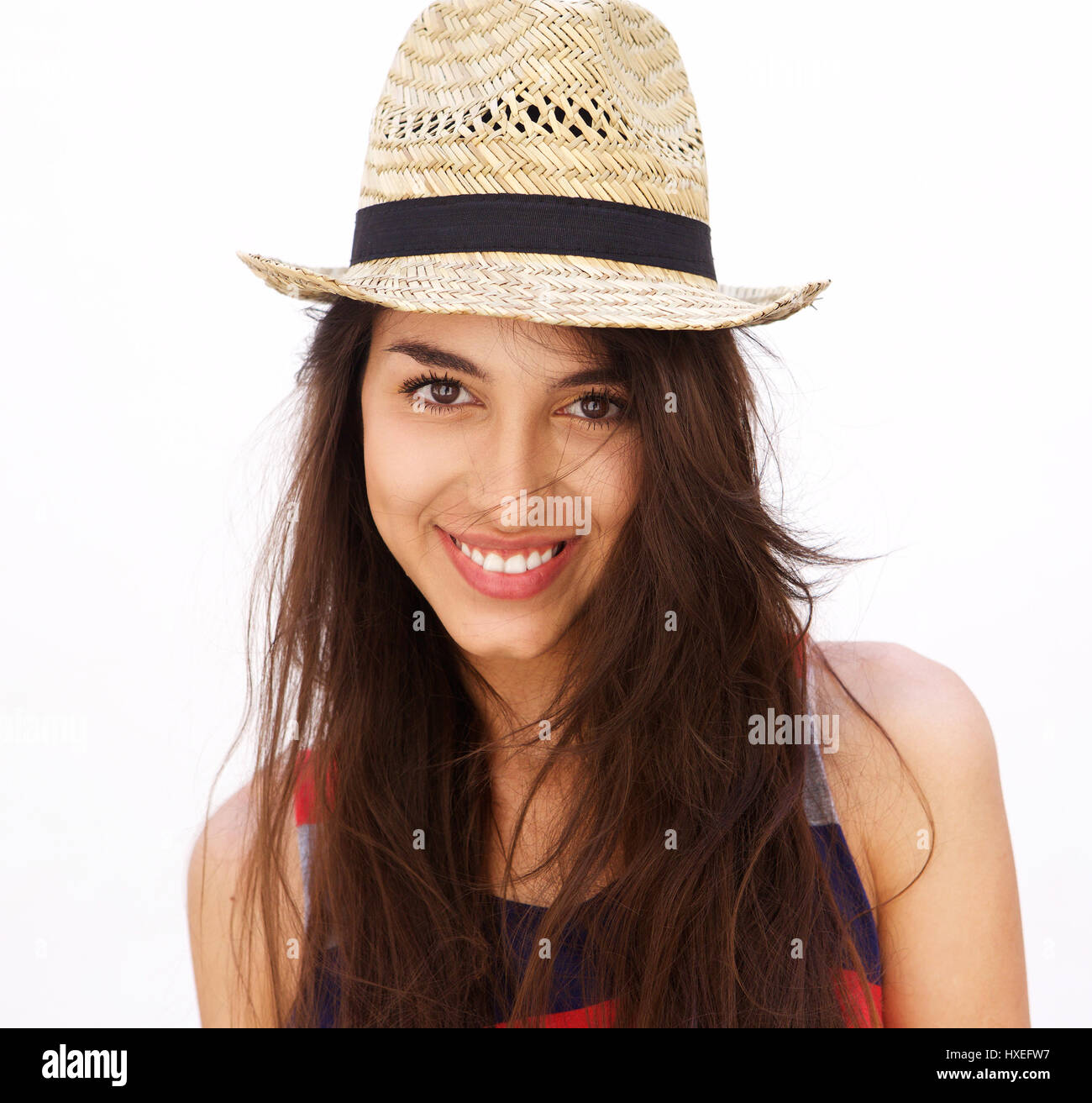 Close up portrait of a beautiful young woman with long hair and hat ...