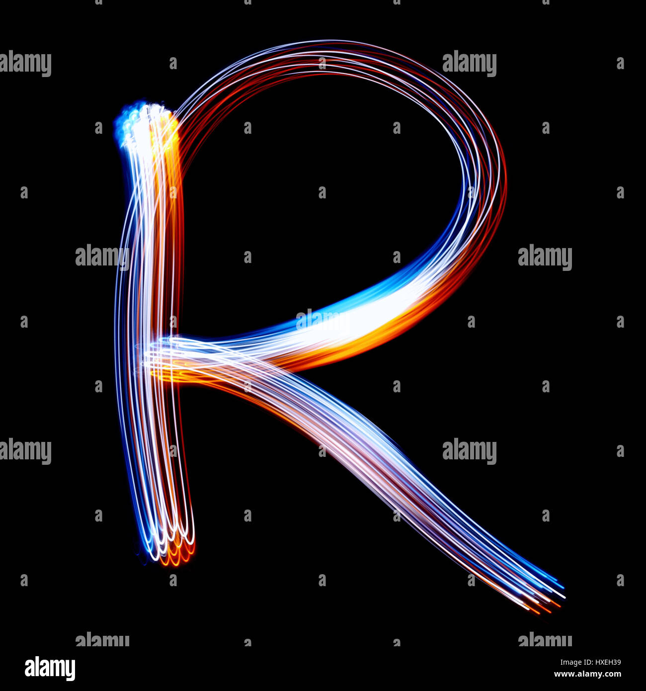 R - Created by light colorful letters over black background Stock Photo ...