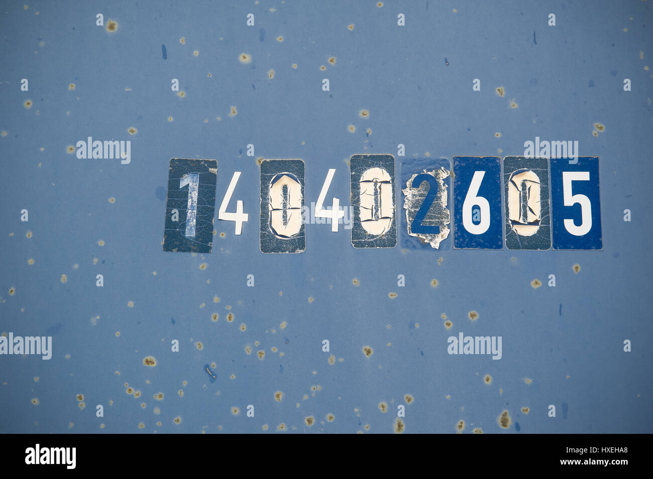 numbers on a blue rusty container background Stock Photo