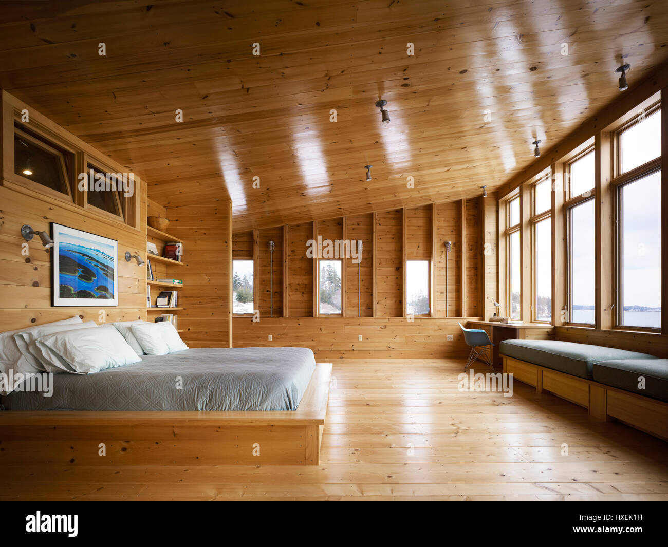 View of the master bedroom upstairs, his and hers desks flanking the window with a sea view. Island House, North Haven, United States. Architect: Chri Stock Photo