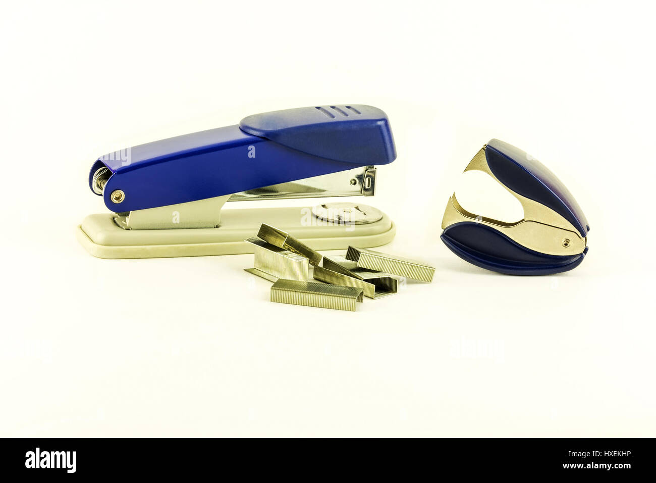 On a white background lie a stapler, staples for stapler and anti ...