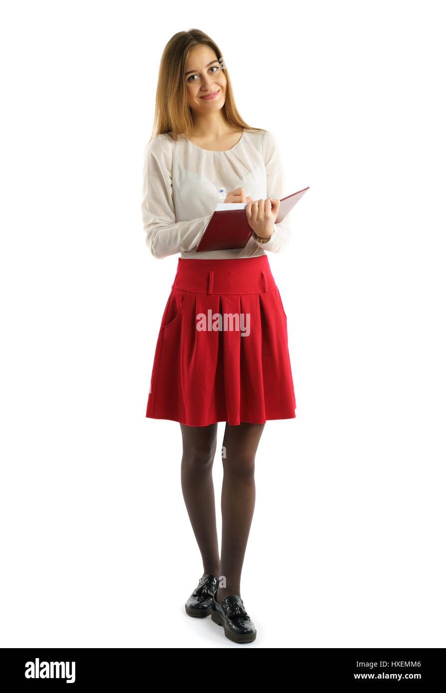 Cute young student girl with book in hands Stock Photo - Alamy