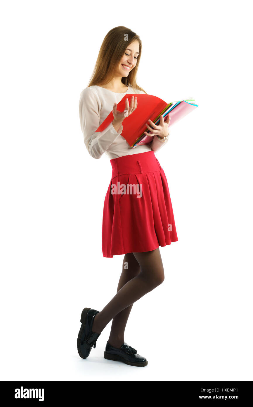 Cute young student girl read red folders Stock Photo - Alamy