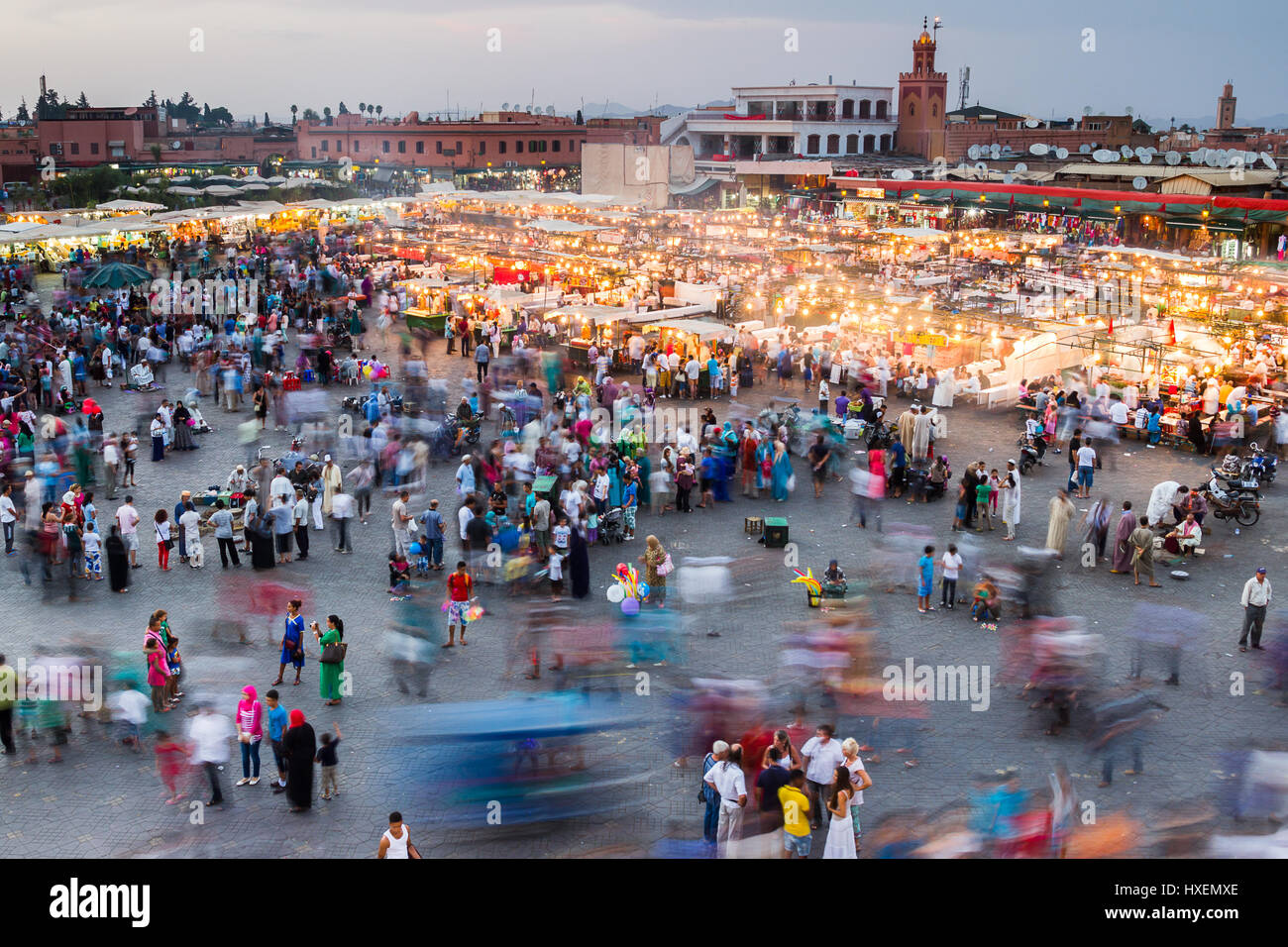 One of my favourite shots in Morocco where I've slowed the shutter speed down to 1.6 seconds to show just how Jemaa el-Fnaa square comes to life when  Stock Photo