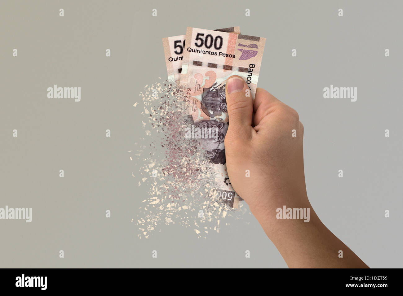 Two five hundred Mexican Pesos bills pulverize in a man's hand Stock Photo  - Alamy