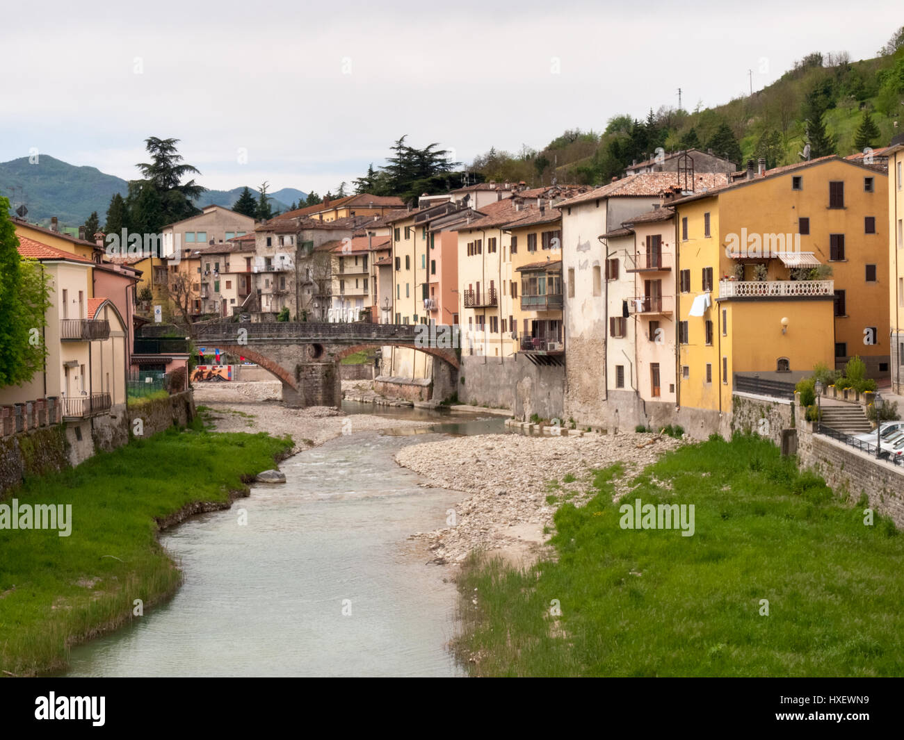Italy, Rocca San Casciano - april 23, 2015: the banks of the river Montone and the Old Bridge in the Valley of 'Acquacheta. The old village is located Stock Photo