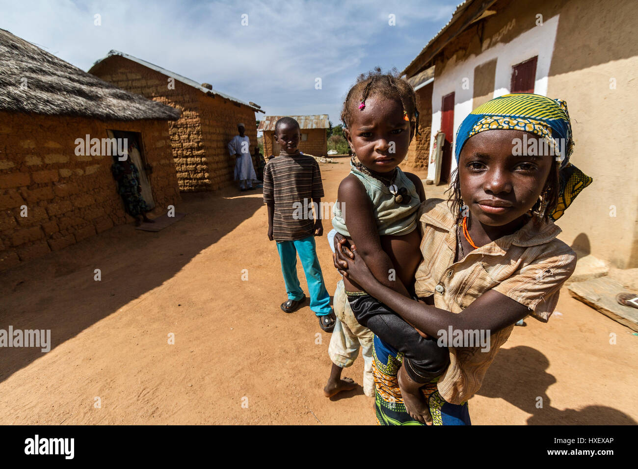 Proud Fulani mother shows her baby in a small village close to Kaduna, Nigeria. Stock Photo