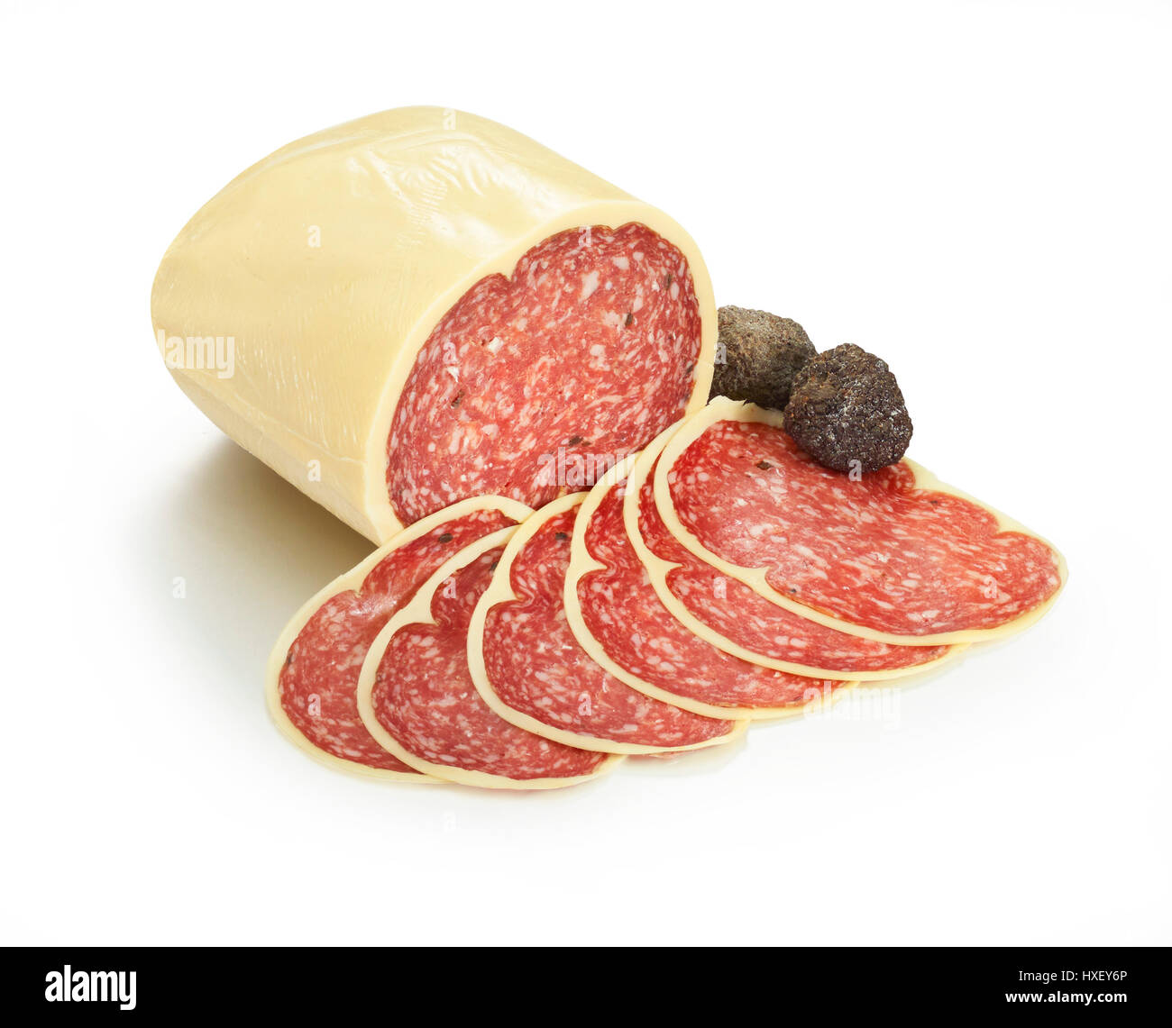 Truffle Salami, partly sliced, with black truffle (Tuberaceae) as decoration Stock Photo