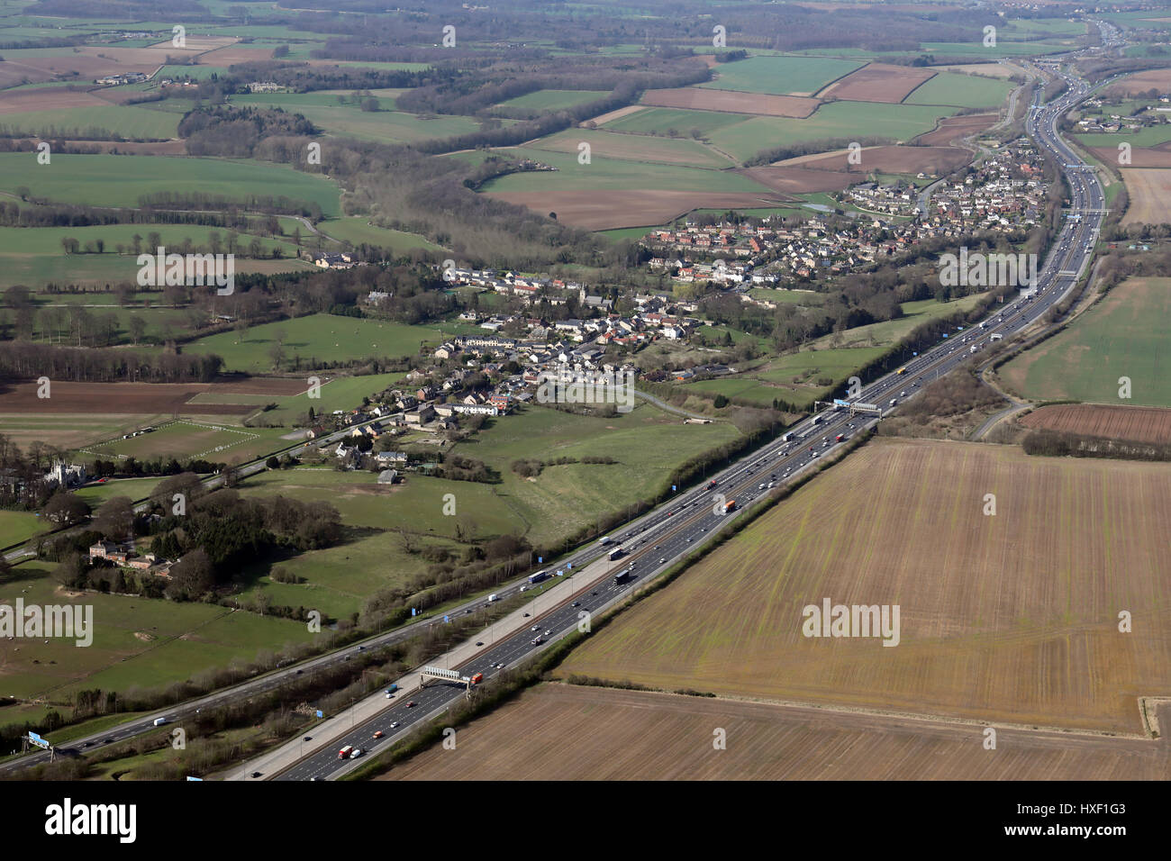 aerial view of the A1(M) as it passes Aberford village, West Yorkshire, UK Stock Photo