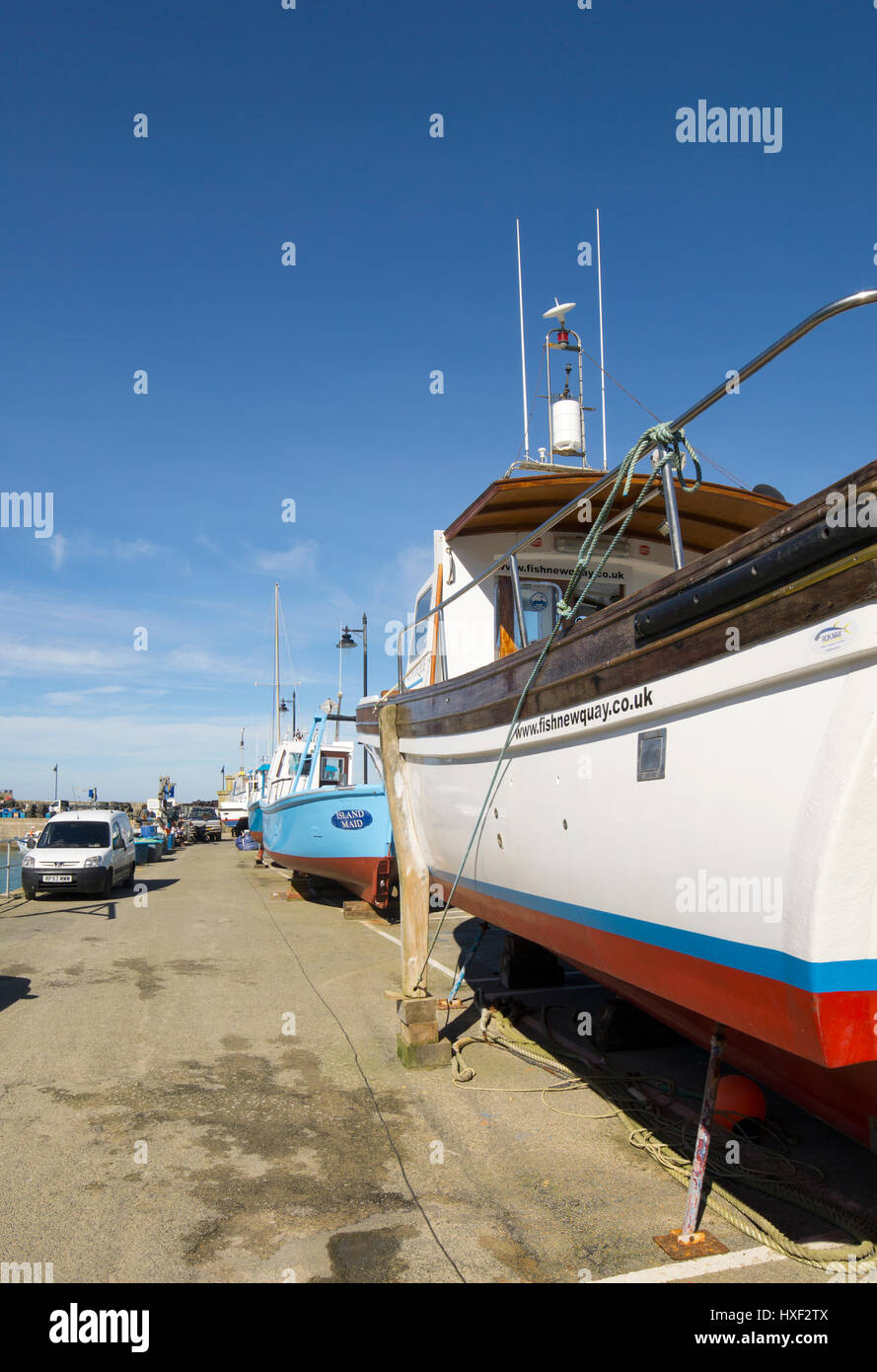 Newquay, freshly painted boats on blocks, harbour quay, Cornwall England UK. Stock Photo