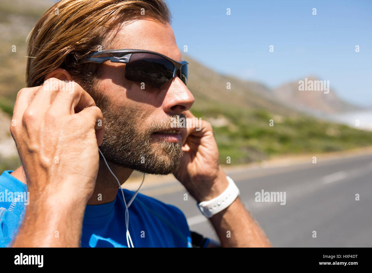 Male athlete in headphones hi-res stock photography and images - Alamy