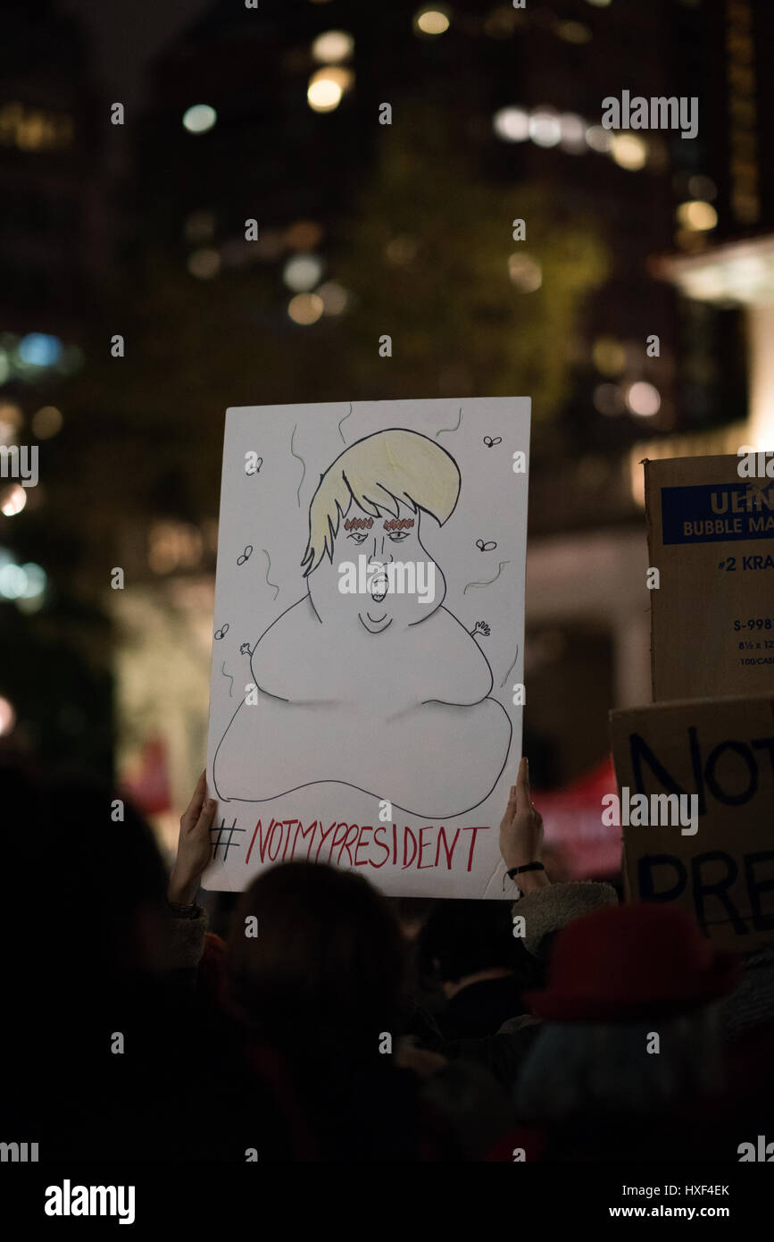 demonstrator in union square holds up a protest sign depicting Trump as a large and smelly jubba the hut. 11/09/2016 NYC Stock Photo