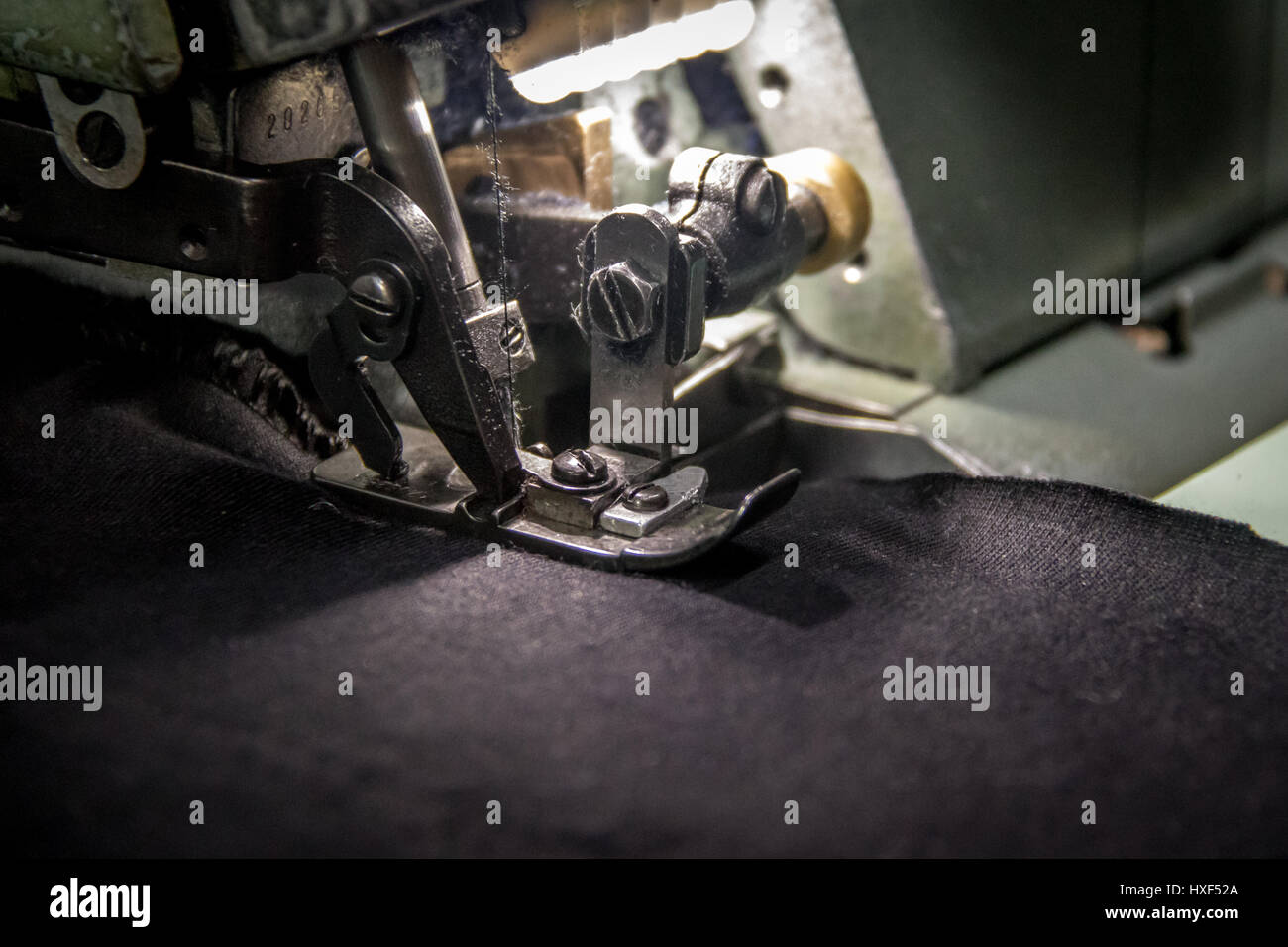 Professional overlock sewing machine with black fabric Stock Photo Alamy