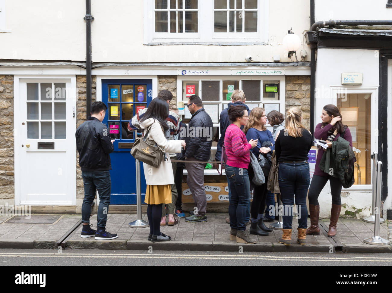 Edamame Japanese restaurant - a queue of people outside , Holywell road, Oxford UK Stock Photo