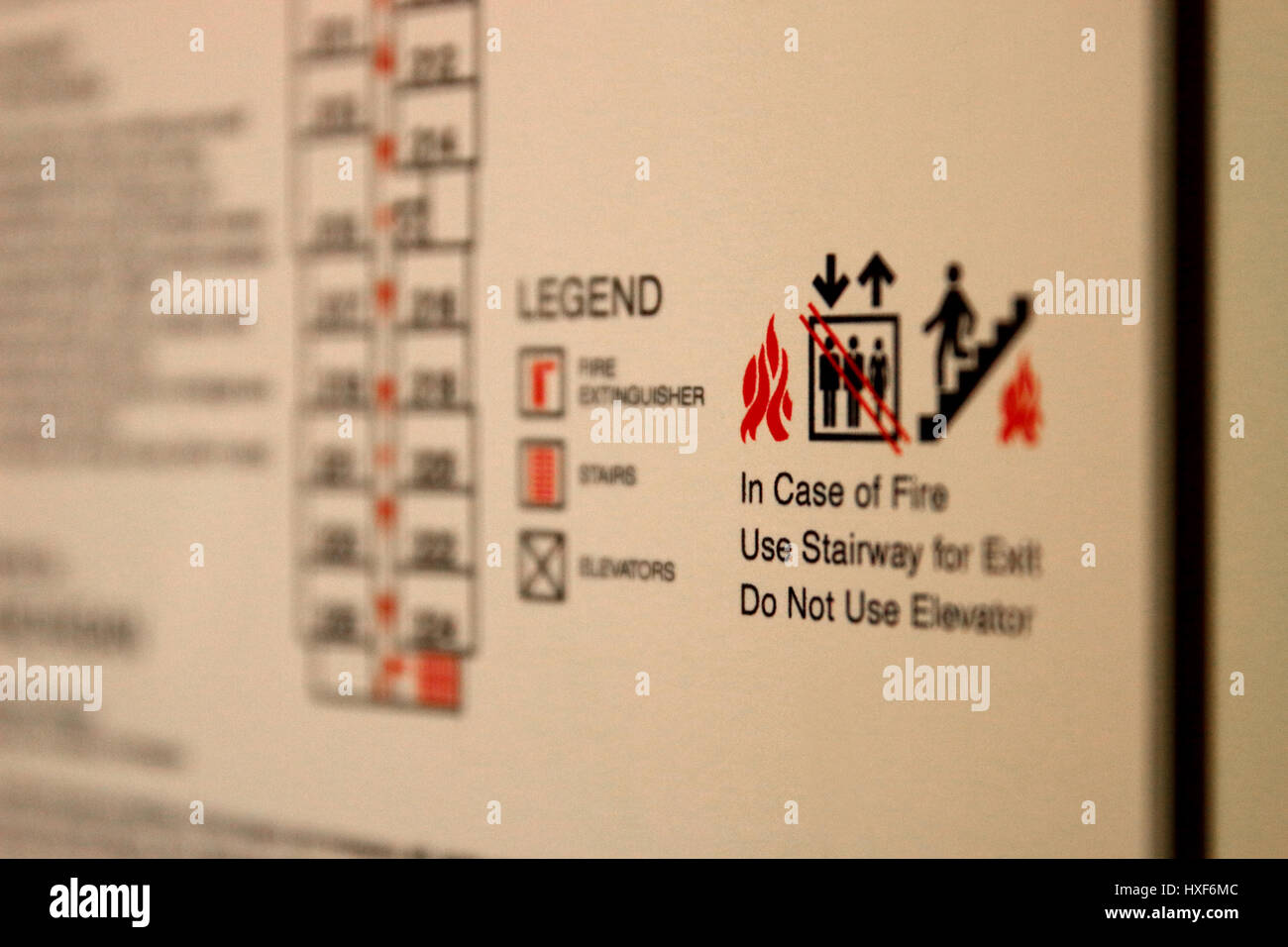 Fire Escape Route placque in a hotel room. In case of Fire Use Stairway for Exit. Do Not Use Elevator Stock Photo