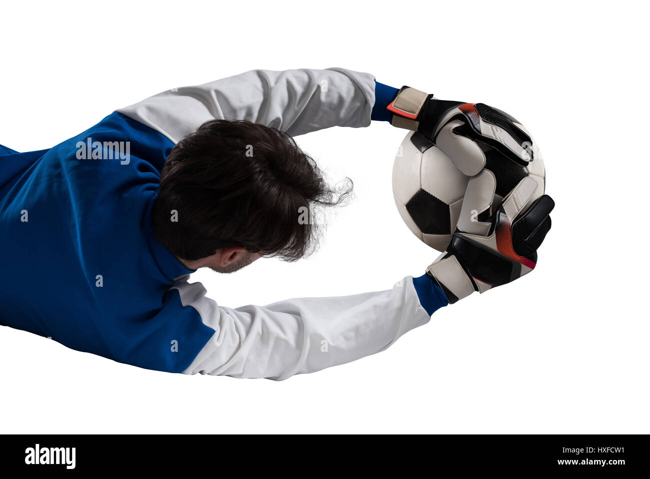 Goalkeeper catches the ball Stock Photo