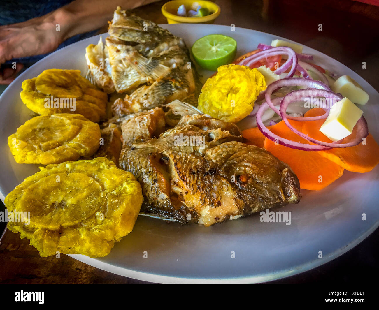 A traditional plate of fried mojarra (fish) from Lake Nicaragua Stock Photo