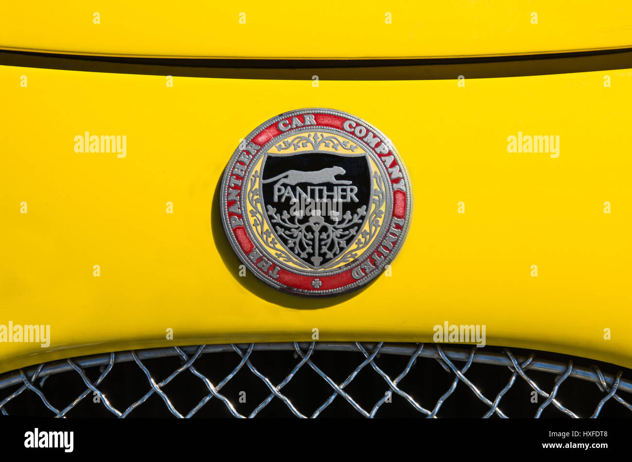 The Panther Car Company Limited Badge, Logo on the front of a Yellow Car. Stock Photo