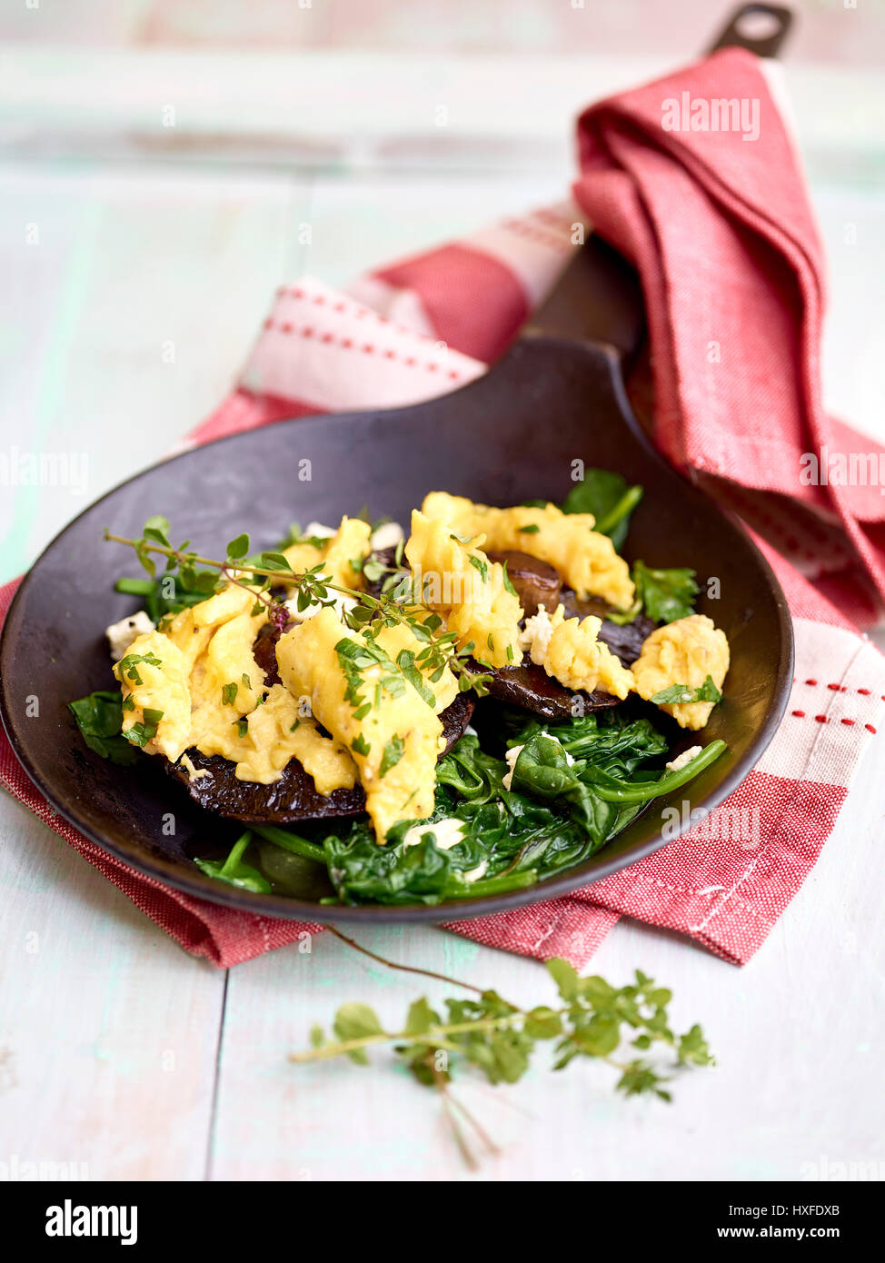 Mushroom, spinach and scrambled eggs breakfast Stock Photo - Alamy