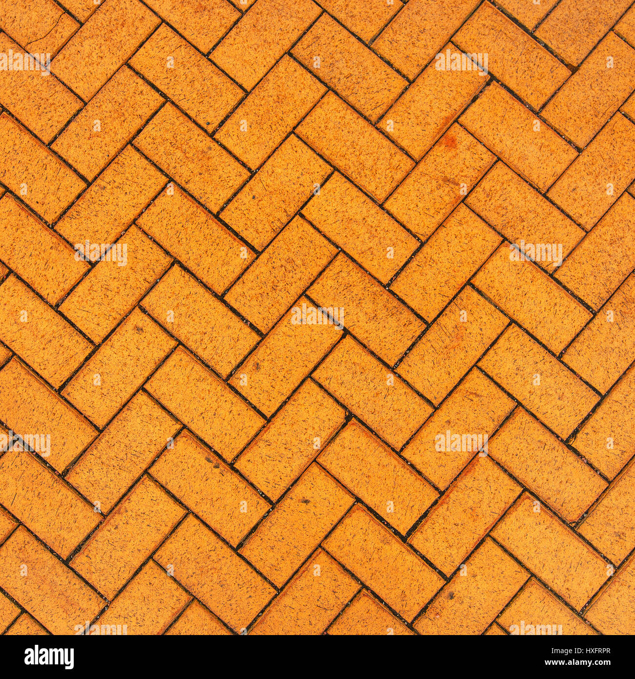 Orange zigzag brick paving texture, top view sample of urban background Stock Photo