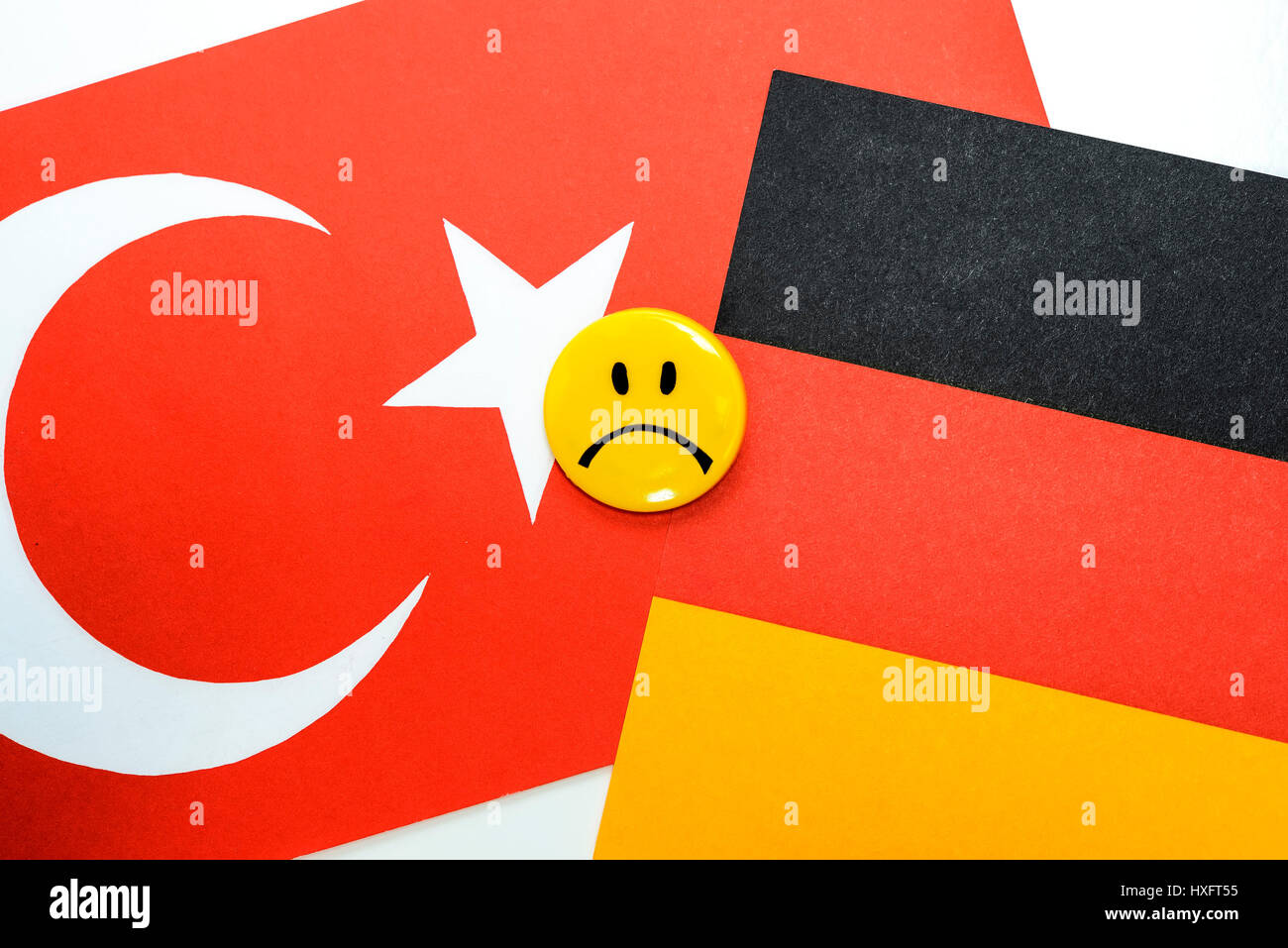Flags of Germany and Turkey with Schlechter-Laune-Smiley, crisis in the German Turkish relations, Fahnen von Deutschland und der TÃ¼rkei mit Schlechte Stock Photo