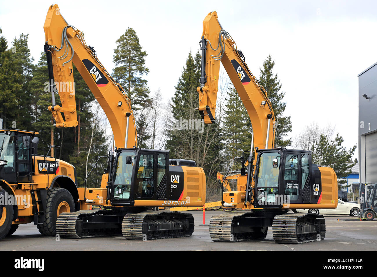 LIETO, FINLAND - MARCH 25, 2017: Cat 323FL and 316FL hydraulic excavators among Cat construction equipment seen at the annual public event of Konekaup Stock Photo