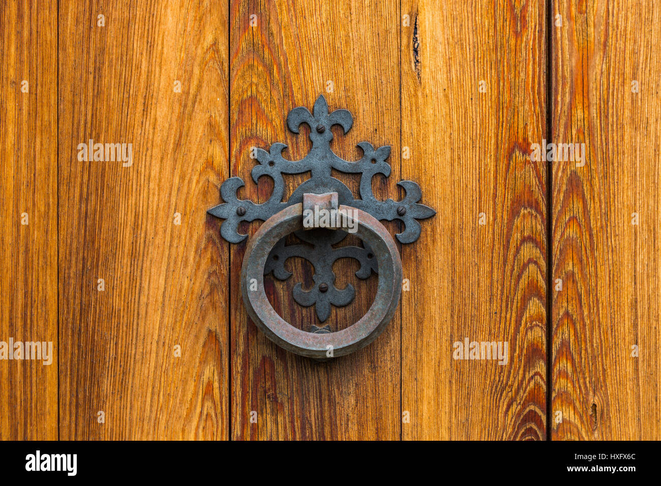 wooden door with iron doorknocker Stock Photo