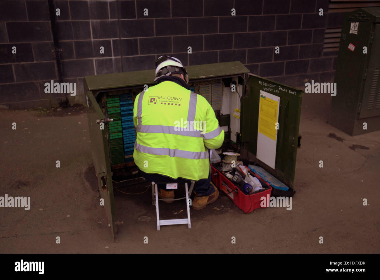 telephone electrical engineer fixing street box Stock Photo