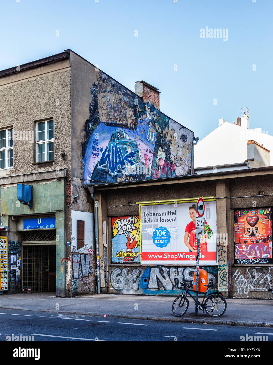 Berlin. Mitte. Entrance to Heinrich Heine U-Bahn underground railway  station in old building with posters and flaking street artwork Stock Photo  - Alamy