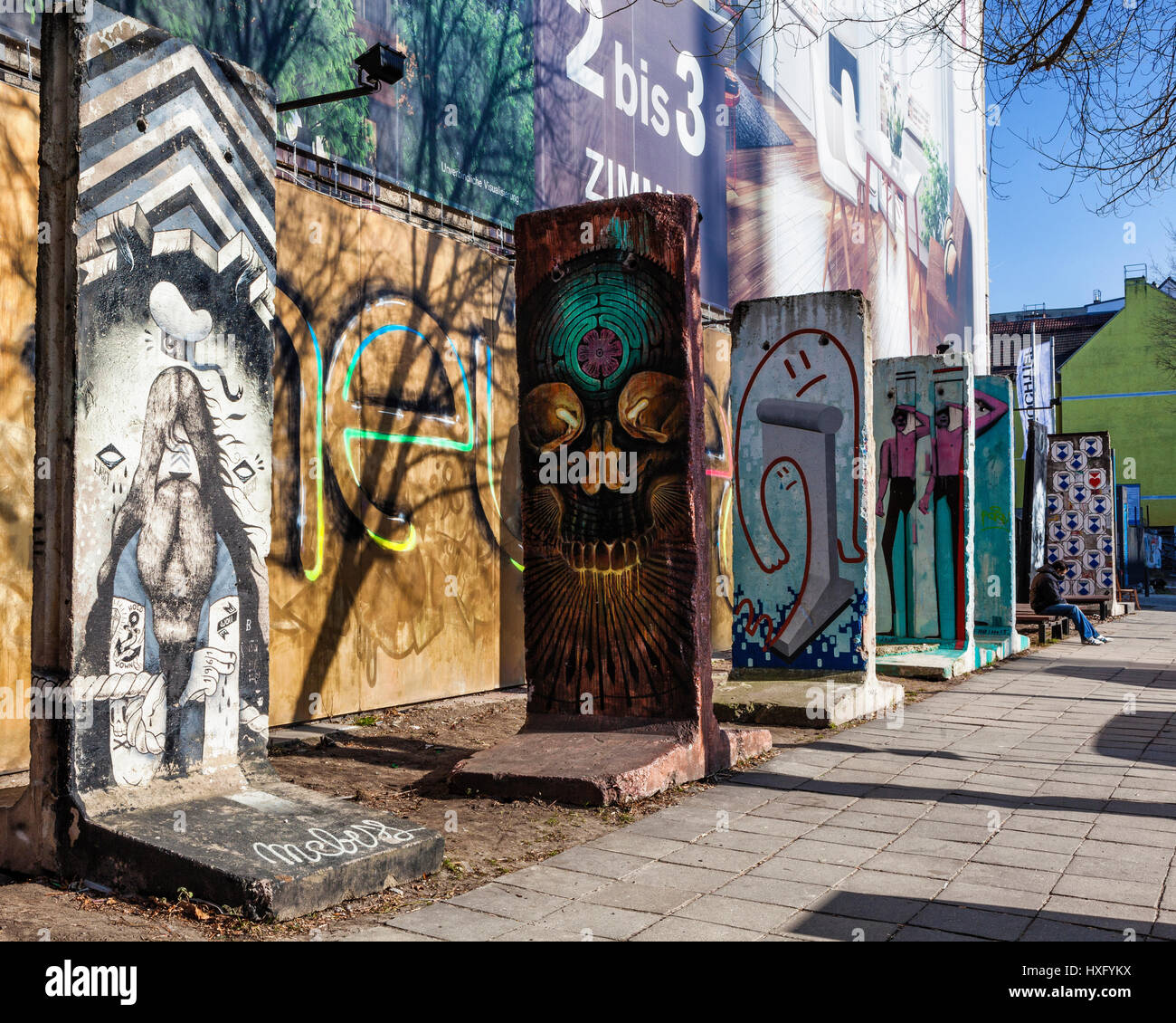 Colourful Berlin Wall Fragment In Berlin, painted section of Berlin