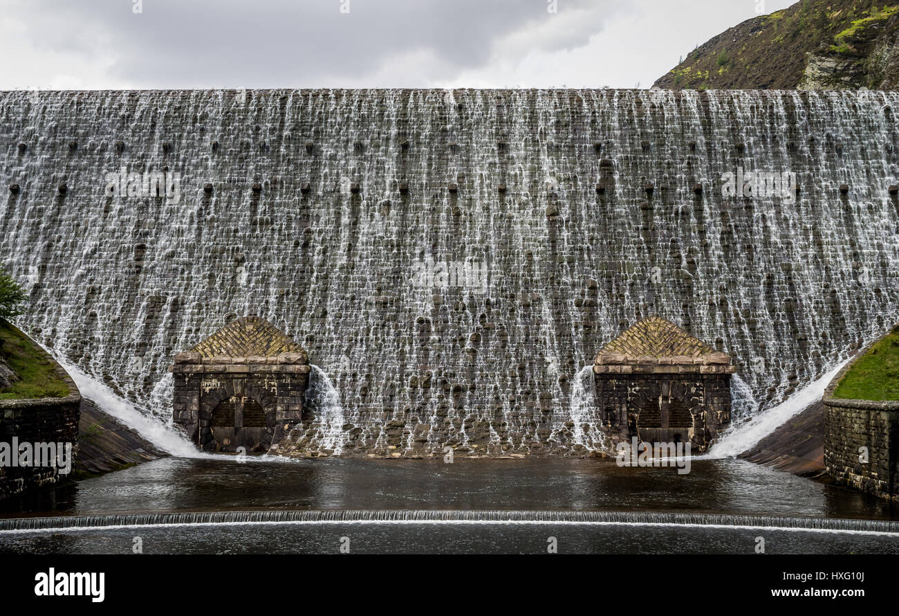 Water rapidly flowing over Caban Coch Dam in Elan Valley, Rhayader. Stock Photo
