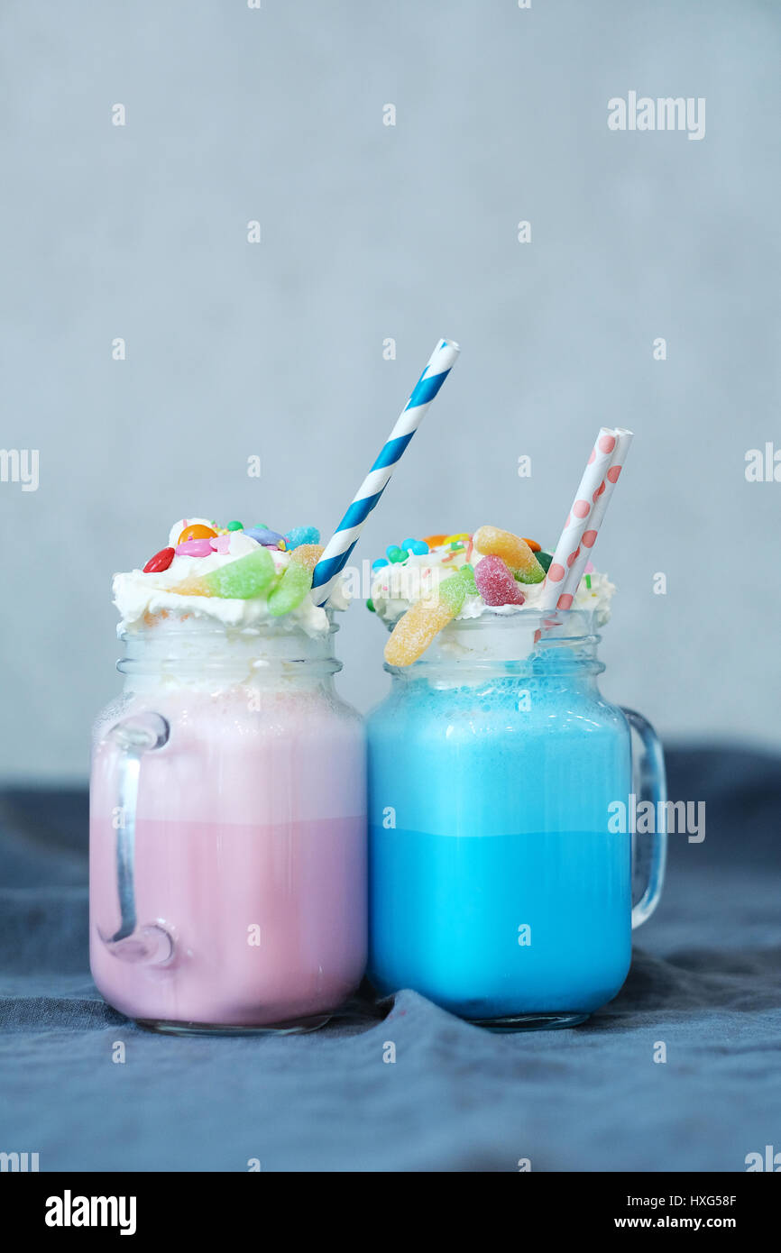 Glass pink milkshake decorated candy hires stock photography and