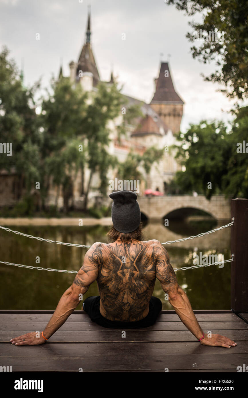 Tattooed athlete is chilling in the Park in Budapest Stock Photo