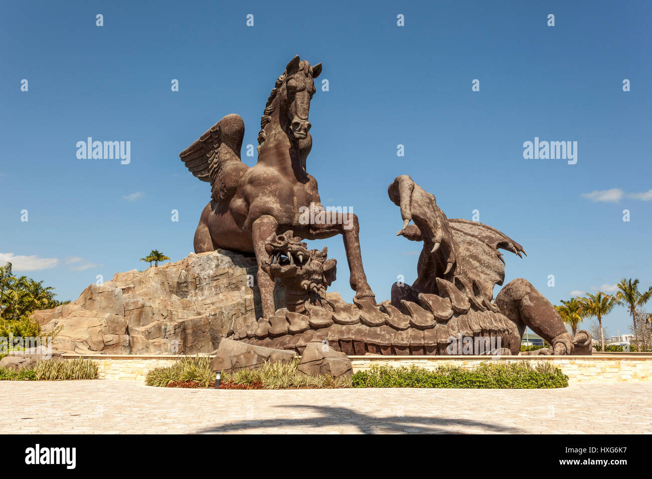 HALLANDALE BEACH, USA - MAR 11, 2017: Statue of Pegasus defeating a dragon in Gulfstream Park. Hallandale Beach, Florida, United States Stock Photo