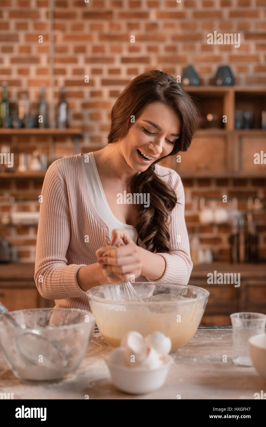  portrait of smiling woman mixing ingredients for cake stock photo alamy