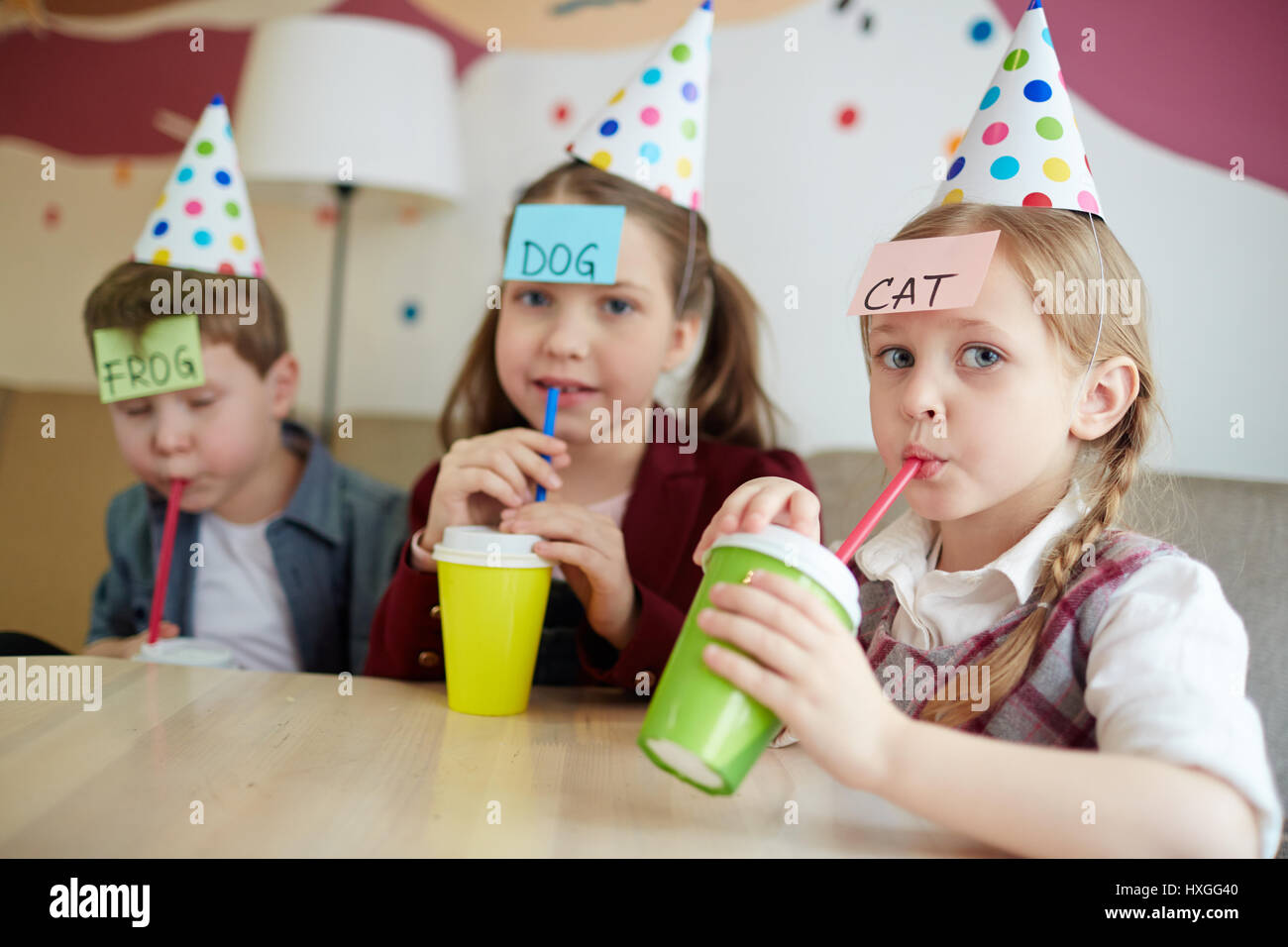 Thirsty Kids Drinking Soda In Cafe And Playing Stock Photo Alamy
