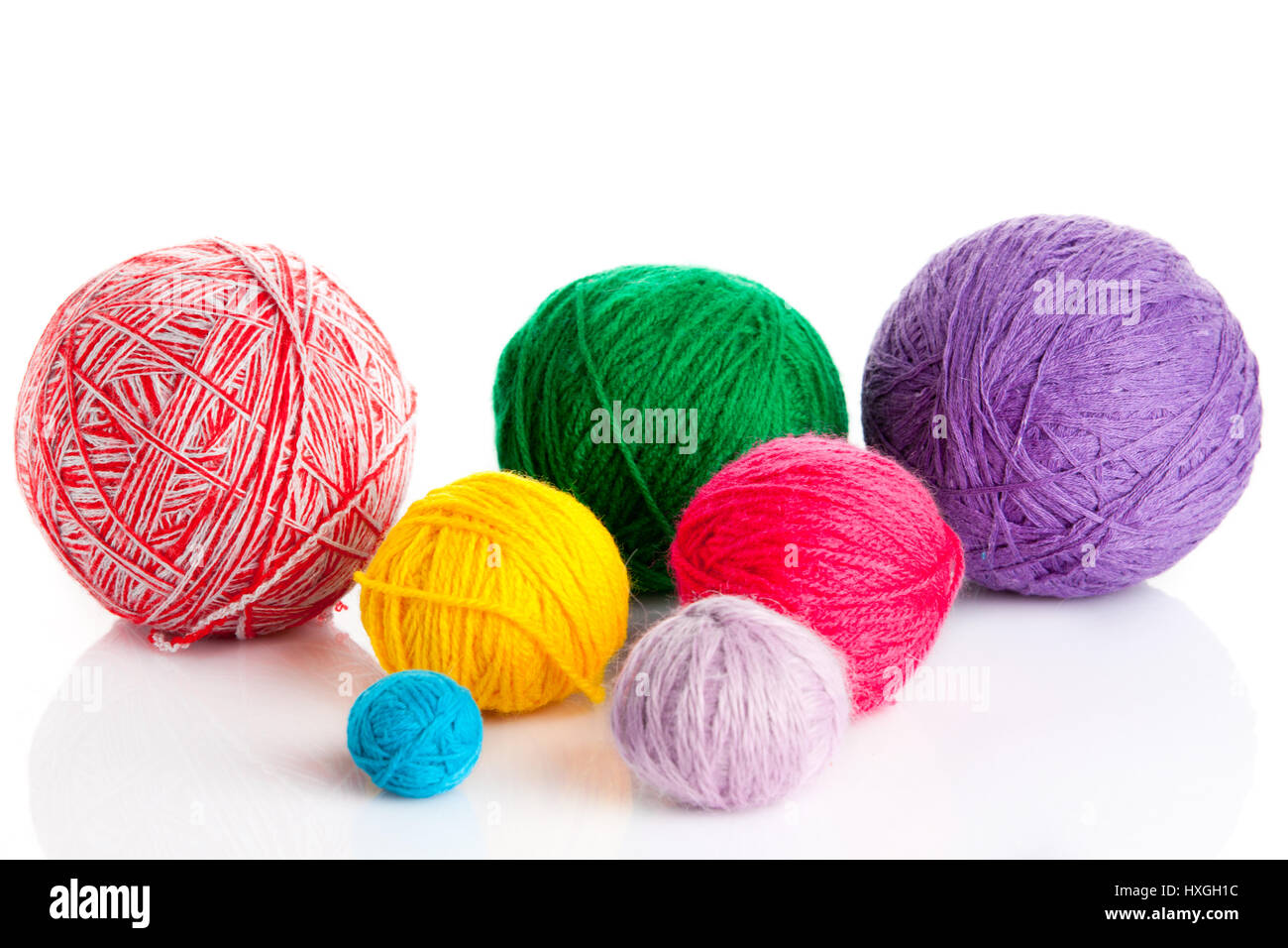 colorful different thread balls. wool knitting on white background ...