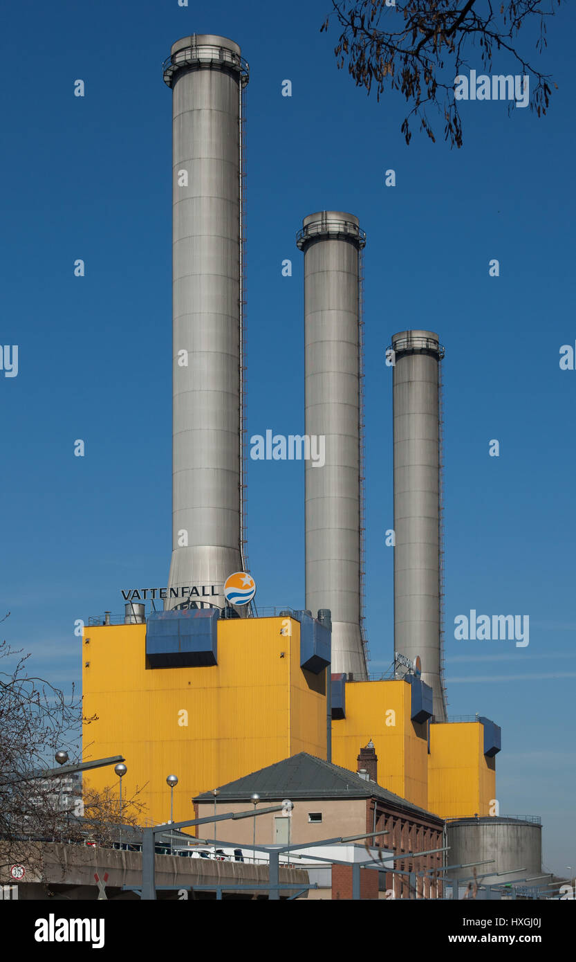 The three striking chimneys from the southern point of view of the Wilmersdorf Power Station in Berlin in the morning sun Stock Photo