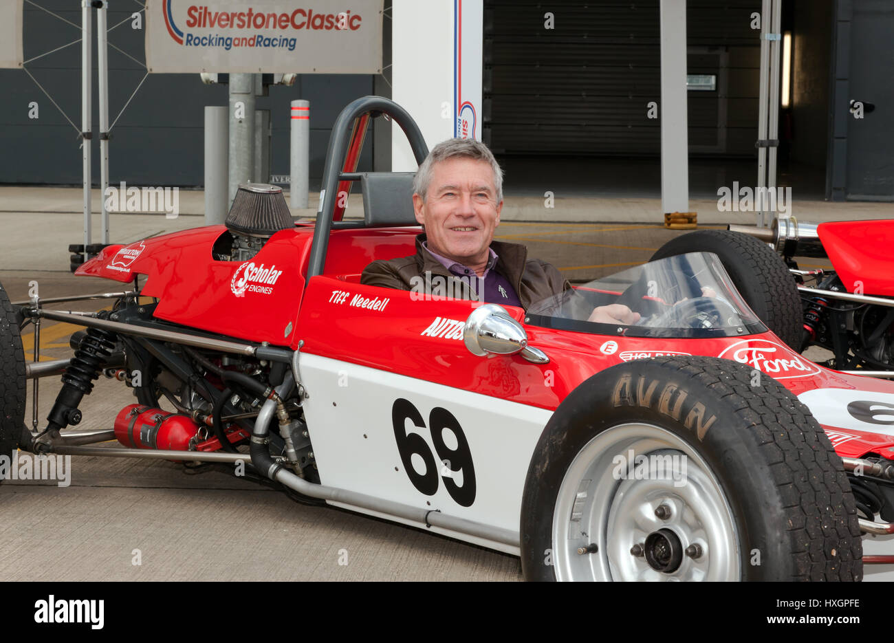 Racing driver and TV presenter, Tiff Needell, sitting in the cockpit of his restored Lotus 69 FF racing car at the Silverstone Classic Media Day Stock Photo
