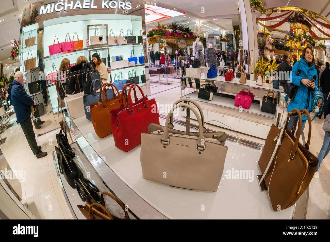 Shoppers browse Michael Kors handbags in the Macy's Herald Square flagship store on Sunday, March 26, 2017. (© Richard B. Levine) Stock Photo