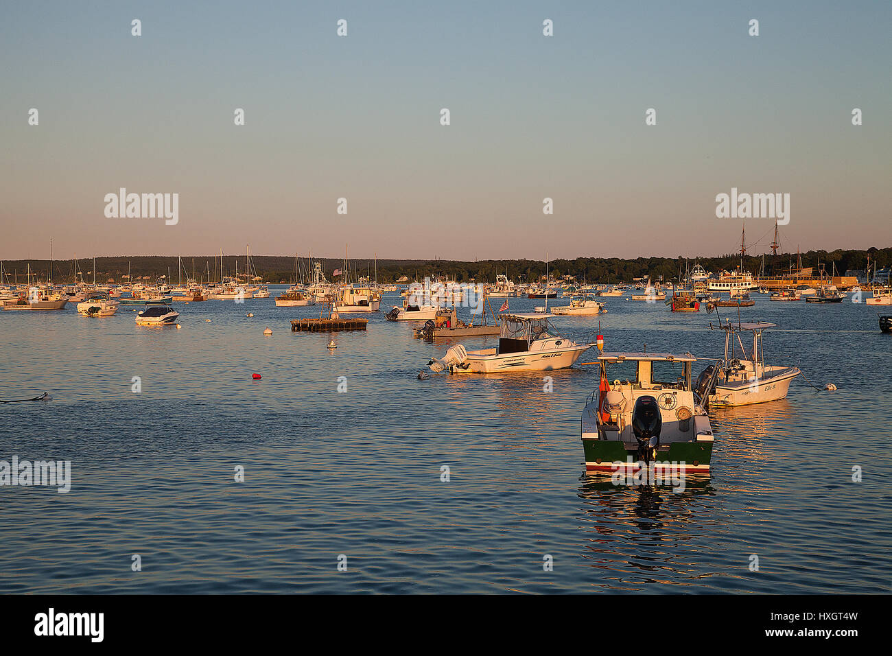 Fishing boats in the harbour at sunset Stock Photo - Alamy