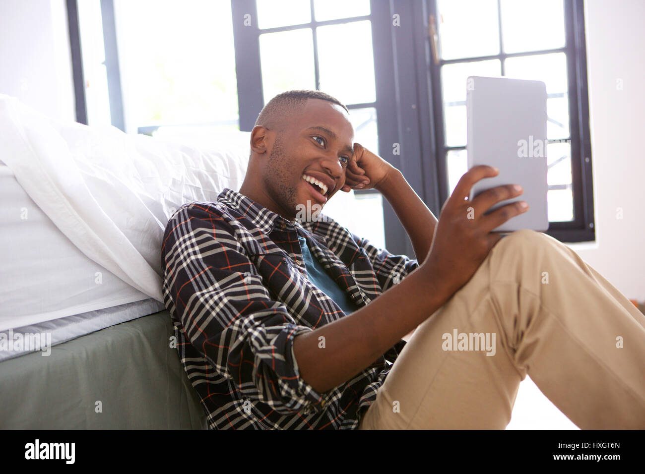 Cheerful afro american guy using hi-res stock photography and images ...