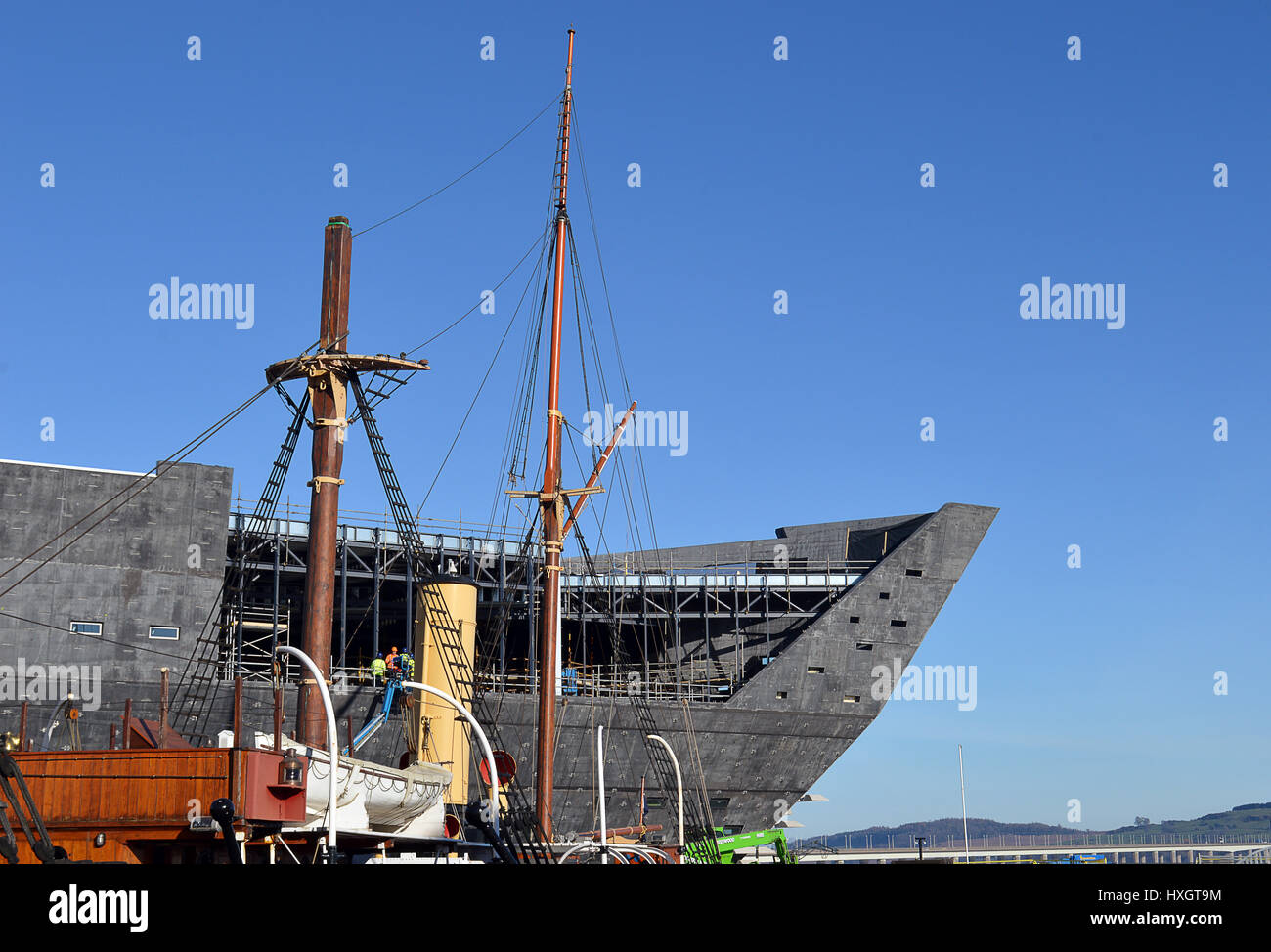 DUNDEE, SCOTLAND - 27 MARCH 2017: The ship shape of the new Victoria and Albert Museum of Design under construction on the north bank of the River Tay Stock Photo