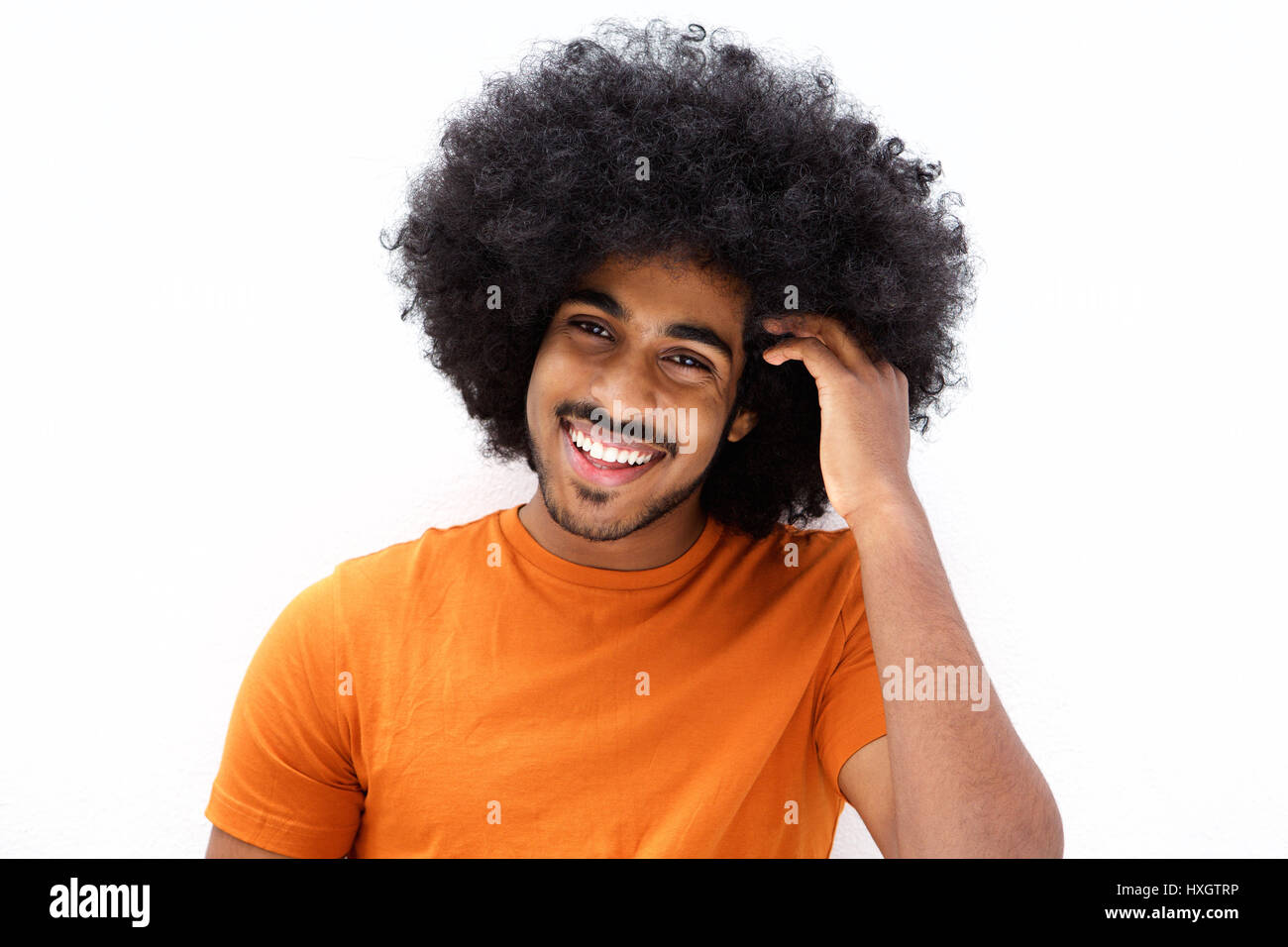 Close up portrait of a cool black guy with hand in afro hair Stock ...